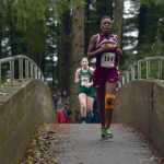 Competitors cross the Indian River at Saturday's 1A, 2A and 3A girls cross country Region V championship meet in Sitka.
