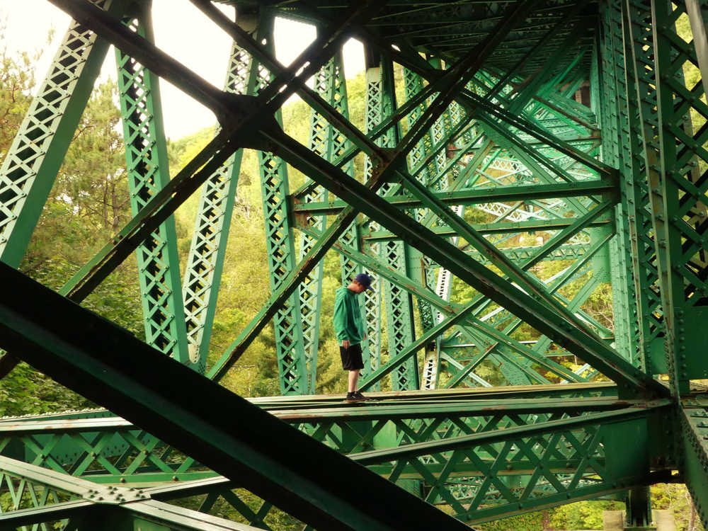 The Cut River Bridge, steel deck cantilever, 147 feet above the river, U.S. Highway 2, Upper Peninsula, Michigan (with a fearless beam walker.)