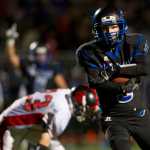Thunder Mountain's  Hansel Hinckle runs the ball in for a touchdown against Juneau-Douglas in a cross town conference game at TMHS on Friday. TMHS won the game.