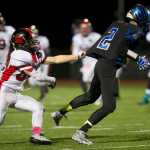 Juneau-Douglas' Donavin McCurley loses his grip on Thunder Mountain's Gabe Crawford in a cross town conference game at TMHS on Friday. TMHS won the game.