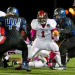 Juneau-Douglas' Lance Galletes-Flagatusa is left no where to run by Thunder Mountain's Alofa Sua, left, and Ivan Williams in a cross town conference game at TMHS on Friday. TMHS won the game.