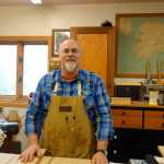 Rainforest Custom owner Dean Graber at his workbench on Sept. 27.