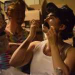 Marty Weiner, played by Annie Bartholomew, finishes applying his moustache before the start of the Femme Fatale drag-show fundraiser Friday, Sept. 30, 2016.