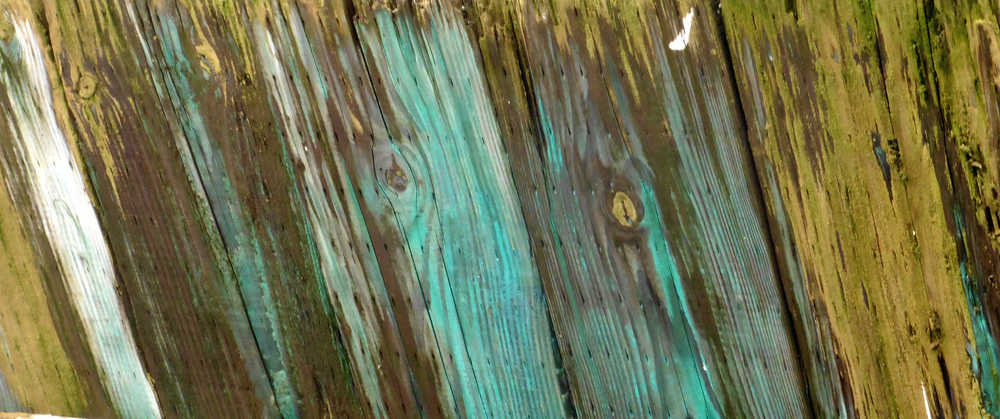 Sea salt and rainy days form their own abstract on a harbor piling.