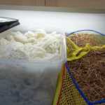 Mountain goat wool, left, and strips of yellow cedar bark sit in the conservation lab at the Alaska State Museum waiting to be spun into warp.