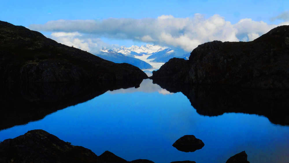 An infinity lake on top of Mt. Ben Stewart with the Mendenhall Glacier in the background.