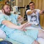 Josh Dybdahl, 30, and Anthony Lindoff, 36, tell their story at Bartlett Regional Hospital on Tuesday after being attacked by a brown bear sow with cubs on Chichagof Island during a deer hunting expedition on Saturday. Dybdahl was being mauled when Lindoff shot and killed the bear.