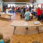 A panoramic view of the multipurpose room in the Gustavus School. About 70 students, 10 staff members and a 15 volunteers participating in the butchering of a moose on Sept. 29.
