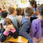 Kindergartener Wynter Schroth isn't so sure about the smell from the recently exposed moose brains.