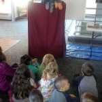 Rich Mattson, aquarium manager and education coordinator at the Douglas Island Pink and Chum salmon hatchery, explains the life cycle of salmon using puppets during a field trip by Semra Deaner's Auke Bay Elementary School kindergarten class on Monday.