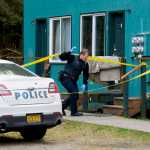 Juneau Police Department Sgt. Krag Campbell investigates the scene of a shooting at the Coho Park Apartments on Friday. Juneau police say a 19-year-old woman was shot in the head on Friday afternoon at the Mendenhall Valley apartment complex, but survived and was medevaced to Anchorage.