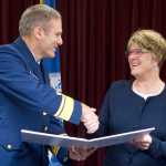 Beth Kerttula, right, is presented the Coast Guard Distinguished Public Service Award for outstanding service as Director of the National Ocean Council from May 2014 to June 2016 by Rear Admiral Michael McAllister, Commander of the U.S. Coast Guard 17th District, on Friday.