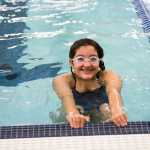 ADVANCE FOR WEEKEND EDITIONS, OCT. 15-16 - In This Sept. 22, 2016 photo, Bethel Regional High School's Skylar Sargent poses in the pool during a morning practice in Bethel, Alaska. Sargent approached the Bethel City Council in fourth grade to ask for a swimming pool; she's now a 10th grader and a member of Bethel's first swim team. (Katie Basil/KYUK via AP)