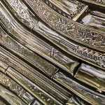 Symmetrical silverware shapes.