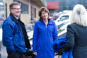 Tyler Myers, president of The Myers Group which owns Super Bear and IGA Foodland, left, talks with U.S. Sen. Lisa Murkowski, center, and Rep. Cathy Muñoz, R-Juneau, after the candidates met with shoppers at Super Bear on Monday.