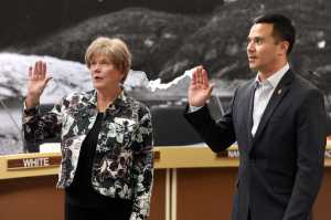 Mary Becker and Norton Gregory are sworn in as members of the City and Borough of Juneau Assembly prior to Monday night's meeting in the Assembly Chambers.