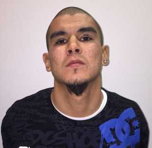 This photo released by Fairbanks Police Department shows Anthony George Jenkins-Alexie. The 29-year-old man was arrested in a shooting that left an Alaska police officer seriously injured. Jenkins-Alexie, of Fairbanks, is facing charges of attempted murder, assault and other counts in connection with the shooting early Sunday of Sgt. Allen Brandt. (Fairbanks Police Department  via AP)