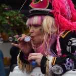 One of Sitka's Alaska Day Keystone Kops blows bubbles from the bed of a pickup truck during Sitka's Alaska Day parade on Tuesday, Oct. 18, 2016.