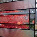 Our maple tree through the prism of our front door window.