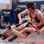 Juneau-Douglas' Steven Ireland-Haight, right, topples Ketchikan's Nolan Meyer in a 160 weight bout in the Brandon Pilot Tournament at TMHS on Friday.
