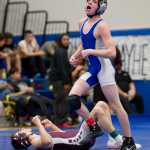 Thunder Mountain's Connor Norman gasps for breath after defeating Ketchikan's Patrick Rauwolf in a 113 weight bout in the Brandon Pilot Tournament at TMHS on Friday.
