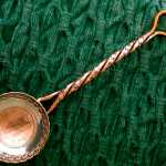 Roger Williams of Gustavus works old or foreign coins into many of his spoons and ladles.