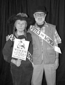 From left to right: LWV of Juneau President carolyn Brown and member George Brown pose in a suffrage-themed photo booth during the organization's annual wine tasting and silent auction fundraiser on Oct. 14, 2016.