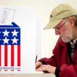John Hartle takes advantage of early voting at the State Office Building on Monday.