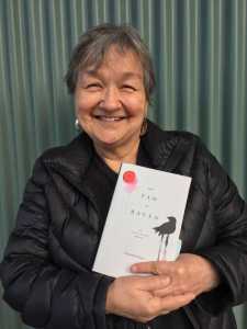 Author Ernestine Hayes holds her latest book "The Tao of Raven: An Alaska Native Memoir."