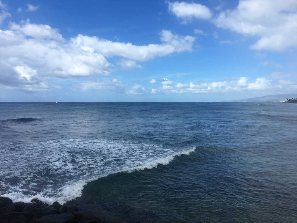 And the surf rolls in at A La Moana Beach, Hawaii.