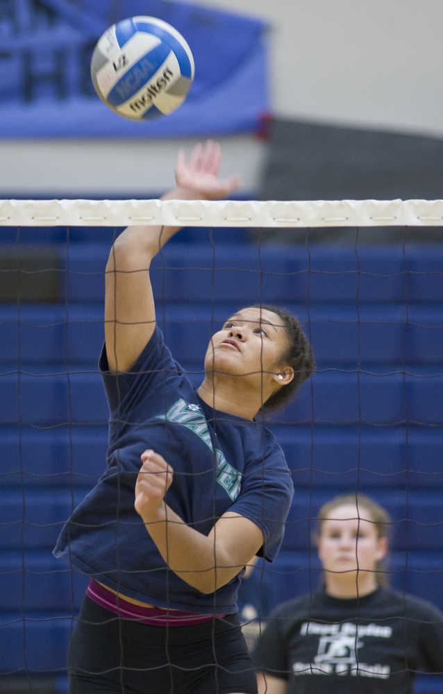 Junior Kyra Jenkins spikes a ball during Thunder Mountain High School varsity volleyball practice at TMHS on Wednesday.