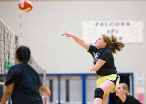 Sophomore Audrey Welling spikes a ball during Thunder Mountain High School varsity volleyball practice at TMHS on Wednesday.