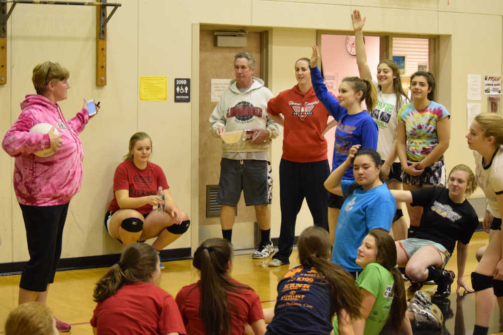 Juneau-Douglas High School volleyball head coach Lesslie Knight (left) talks strategy with her team, coach Pat Gorman and varsity coach Leslie Kalbrener at a Wednesday practice.