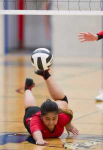 Juneau-Douglas' Patricia Enriquez dives for the ball against Thunder Mountain at TMHS on Friday. Juneau_Douglas won 25-13, 25-14, 26-24.