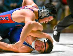 Sitka High School junior Kyler Sumauang, top, grapples with Juneau wrestling team member senior Deven Mason Saturday, Oct. 29, 2016, during the 152-pound championship match of the Bill Weiss Invitational Tournament. Sumauang won by major decision, 12-2.