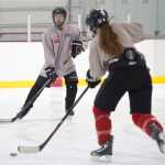 Alexis Doutt, right, passes to Cameron Jardell during Juneau-Douglas High School hockey practice at Treadwell Arena on Wednesday, Nov. 2, 2016.