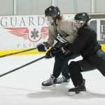 Ryan Liebelt, left, and Cahal Morehouse battle for the puck during Juneau-Douglas High School hockey practice at Treadwell Arena on Wednesday, Nov. 2, 2016.