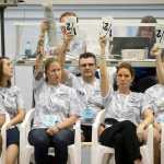 Diving judges show their scores to the announcer during the 2016 ASAA/First Natinal Bank Alaska Swim & Dive State Championships at the Dimond Park Aquatics Center on Friday, Nov. 4, 2016.