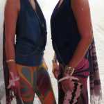 Crystal Worl, right, is starting a women's clothing line at Trickster Company. She and Trickster team member Erika Bergren, left, modeled some of those clothes, including formline-inspired leggings, clutches printed with Worl's art, body jewelry and bracelets (Worl and her brother, fellow Trickster Company owner Rico Worl, collaborate to create the jewelry; the body jewelry is inspired both by formline and "modernized Athabascan beadwork floral patterns") and a silkscreen printed, formline pashmina. They are wearing earrings from Navajo artist Meek Watchman. Worl was the featured emerging designer of the evening.