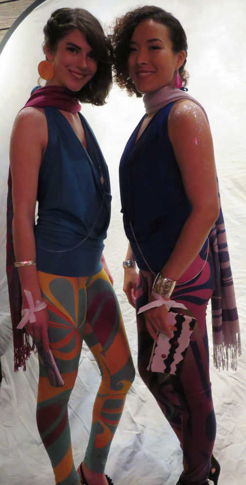 Crystal Worl, right, is starting a women's clothing line at Trickster Company. She and Trickster team member Erika Bergren, left, modeled some of those clothes, including formline-inspired leggings, clutches printed with Worl's art, body jewelry and bracelets (Worl and her brother, fellow Trickster Company owner Rico Worl, collaborate to create the jewelry; the body jewelry is inspired both by formline and "modernized Athabascan beadwork floral patterns") and a silkscreen printed, formline pashmina. They are wearing earrings from Navajo artist Meek Watchman. Worl was the featured emerging designer of the evening.