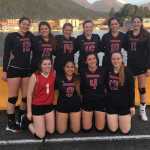 The Juneau-Douglas volleyball team poses for a team photo after winning the Region V tournament in Sitka over the weekend.