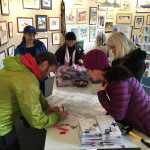 Rep. Cathy Muñoz, at background right, talks to campaign volunteers and staff as she plans her walking route Saturday, Nov. 5, 2016.