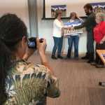 Justin Parish, Democratic candidate for House District 34, prepares to pose for a photo with supporters Saturday, Nov. 5, 2016 at the Mendenhall Valley Public Library.