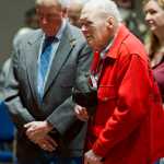 Veterans Howard Colbert, left, and Pat Carothers listen to the benediction at Veterans Day ceremonies at Centennial Hall on Friday. Carothers served in the WWII, Korea and Vietnam Wars.