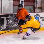 Sarah Lowell (yellow) looks to contain Laine Durgin during a Friday evening Juneau Jamboree contest at Treadwell Ice Arena.
