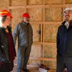Mariya Lovishchuk, the executive director of the Glory Hole, John Gaguine, center, boardmember of the Juneau Community Foundation, and Joe Nelson, board chair for Sealaska, tour the Housing First Project on Jenkins Drive on Thursday, Nov. 17, 2016.