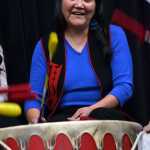 Noreen Otnes, a recovering addict, pounds a drum during a Juneau Reentry Coalition community get together Saturday afternoon. Playing the drums helps "heal the spirit," according Justin McDonald, who led the drum group.