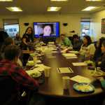 The Sm'algyax Language Learners group sings a Christmas carol in Sm'algyax, the language of the Tsimshian people, on the one-year anniversary celebration of the group's beginning. Standing is Nancy Barnes, one of the group's organizers.