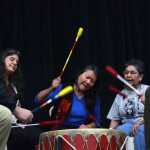 Noreen Otnes (center), a recovering addict, pounds a drum during a Juneau Reentry Coalition community get together Saturday afternoon. Playing the drums helps "heal the spirit," according Justin McDonald (left), who led the drum group.