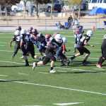 Gabby Soto rushes with the ball for the Juneau Raiders, who won the National Youth Football Championships over Thanksgiving weekend.